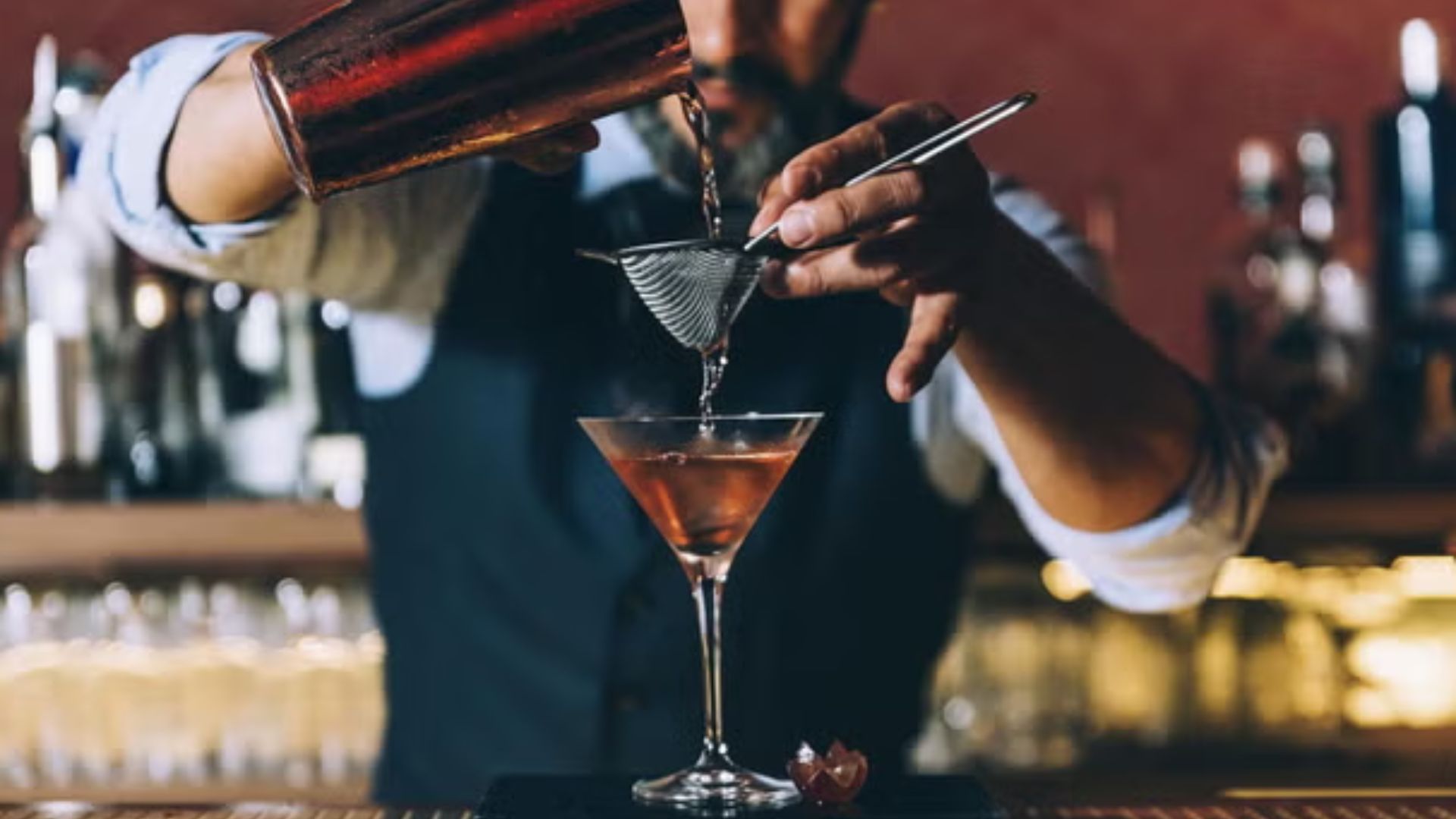 image of a bartender mixing wine